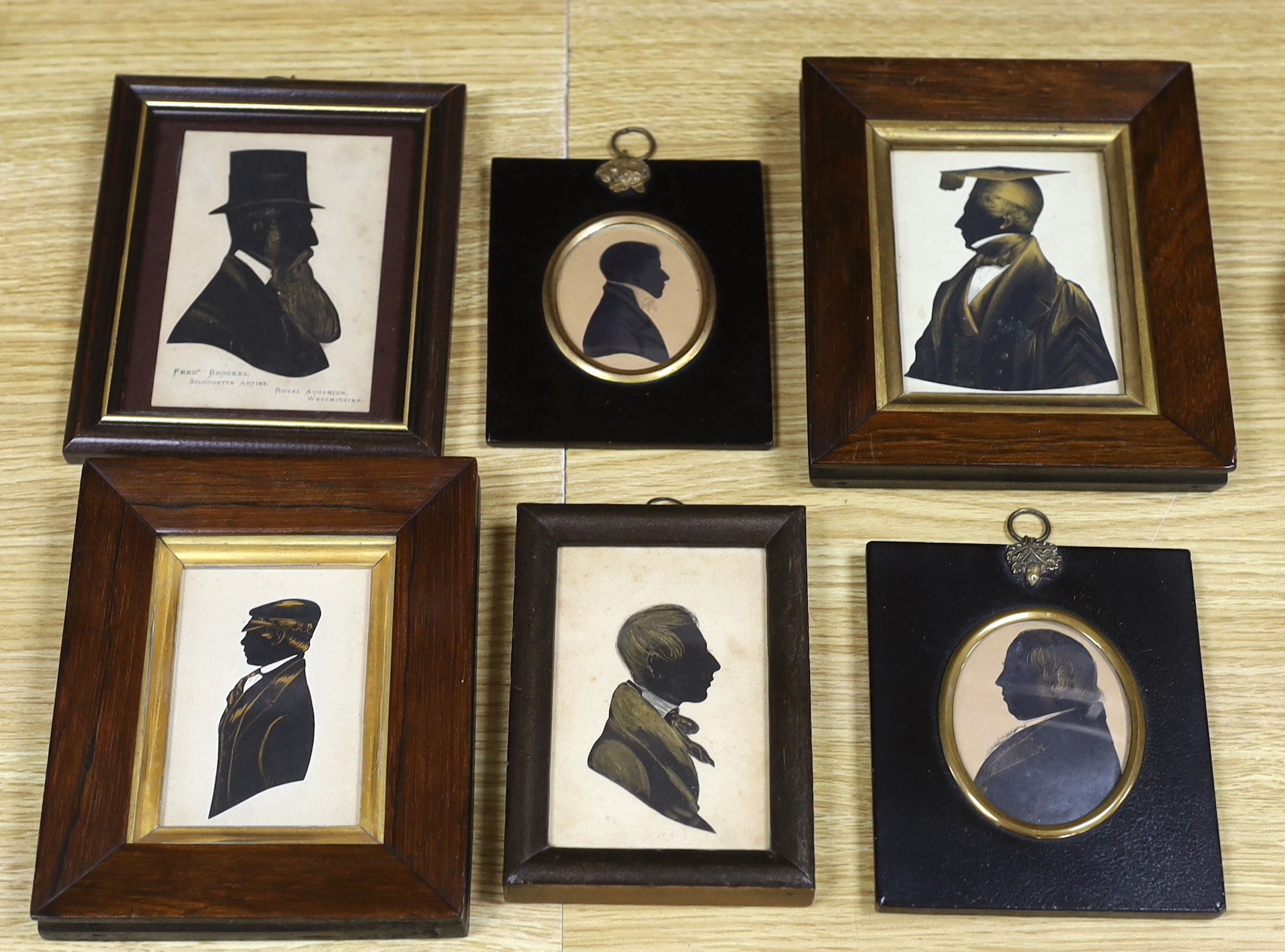 Six assorted 19th century silhouettes including H.J. Walter, cut and bronzed profile of a boy, 1850, 9 x 6cm; Fred Brookes, profile of a bearded gentleman and a bronzed study of a tutor, 10 x 7.5cm